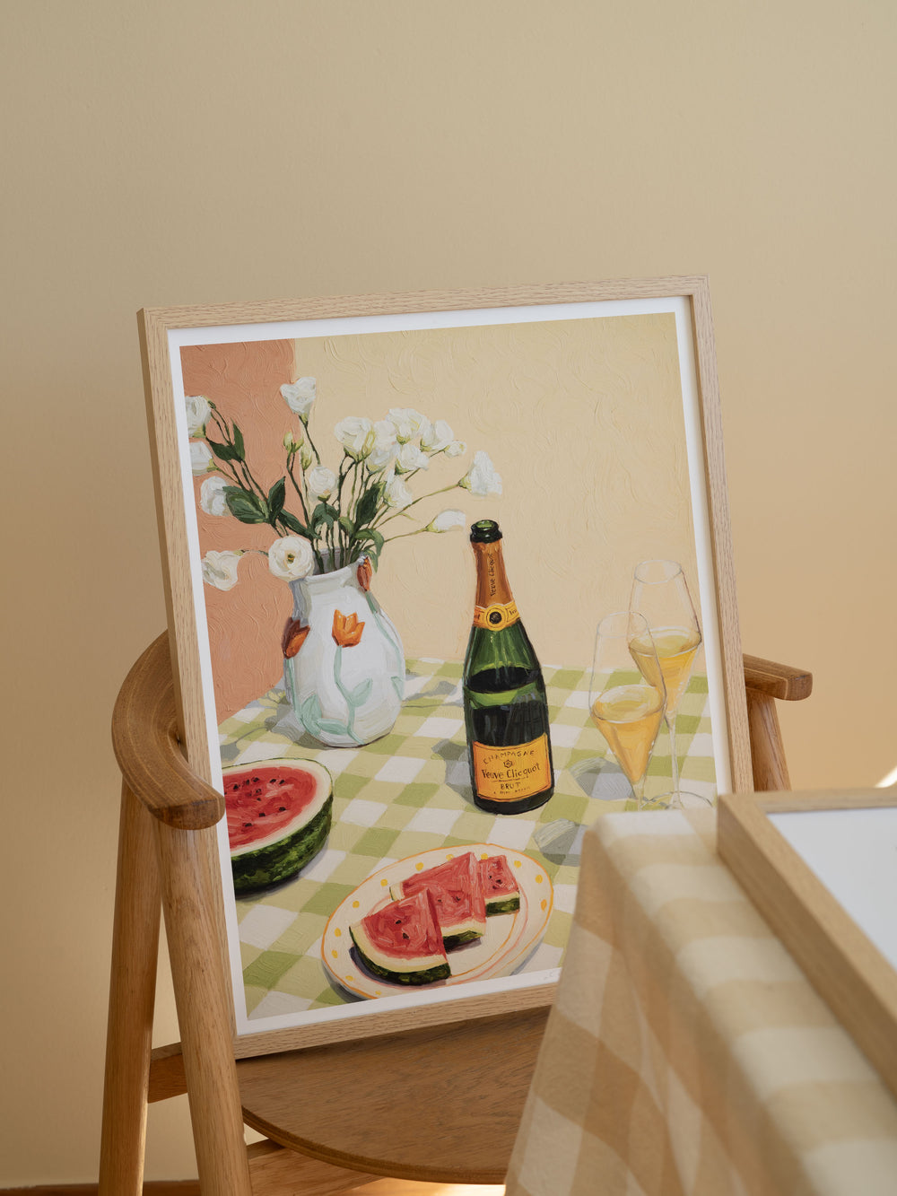 Still life print "Celebrating Summer" featuring a champagne bottle, two glasses, flowers, and watermelon with bold brushstrokes and bright colors.