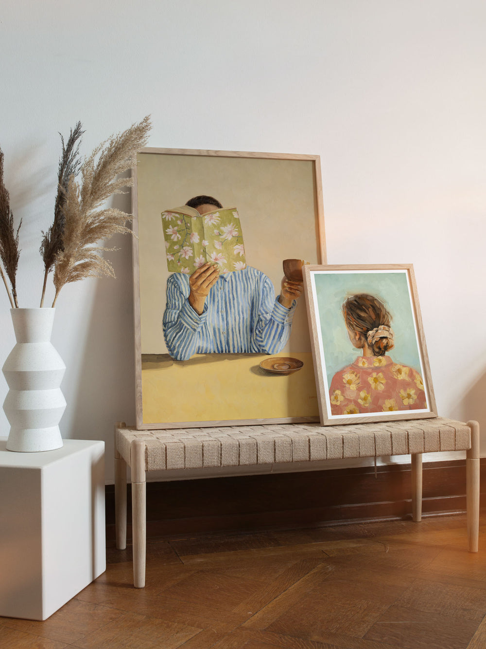 art print featuring a woman reading a book and holding a cup