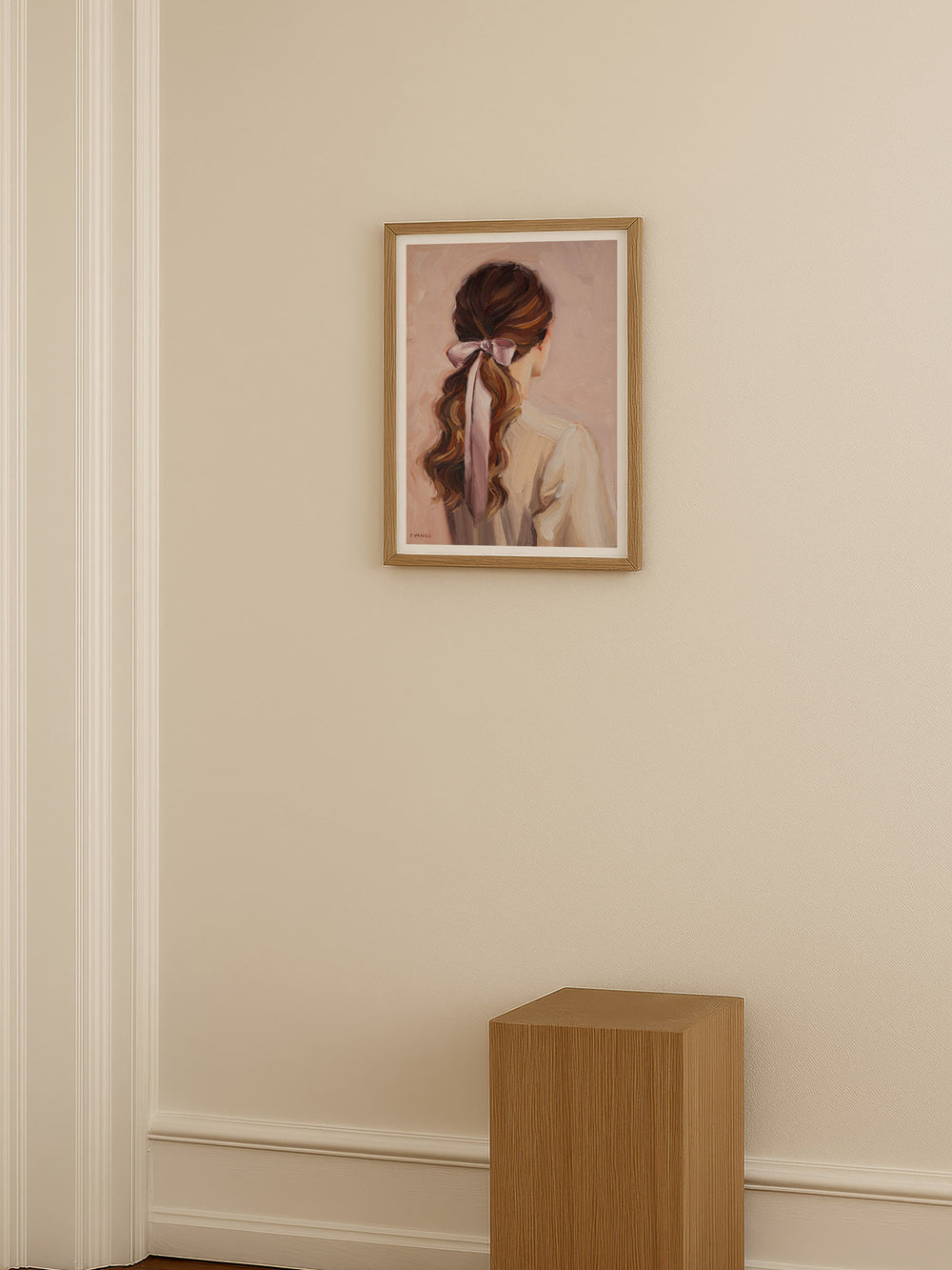 Art print of a woman with long hair tied back with a pink ribbon on a beige background