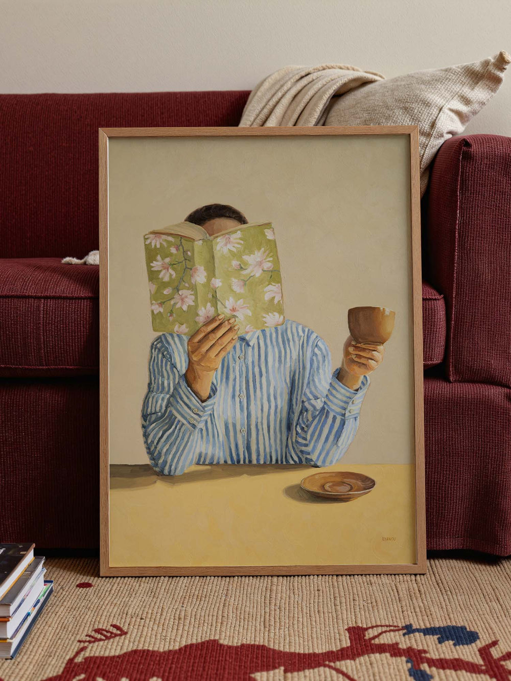 art print featuring a woman reading a book and holding a cup