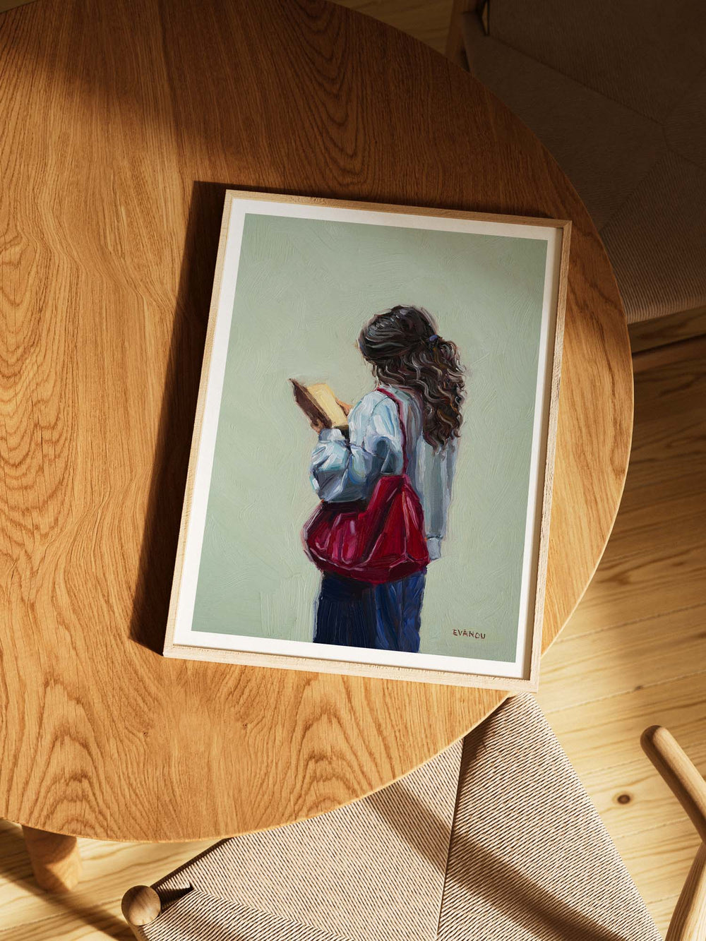 Painting of a person with long hair holding a book against a light green background