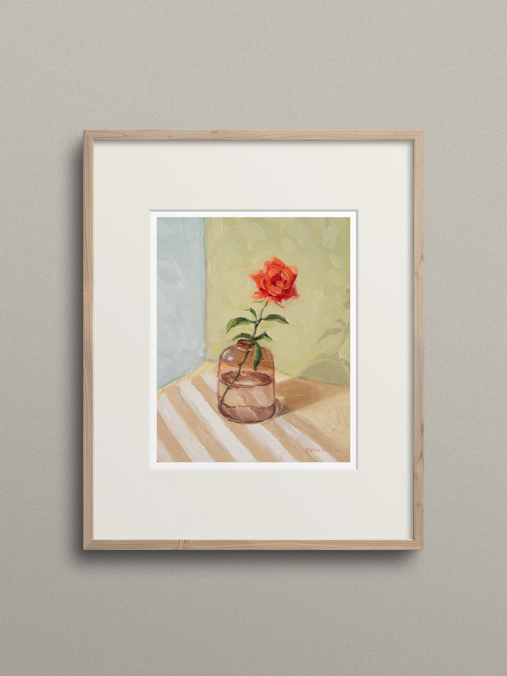 Art print of a red rose in a glass vase on a striped surface with a soft background