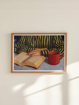 art print featuring a figure reading a book