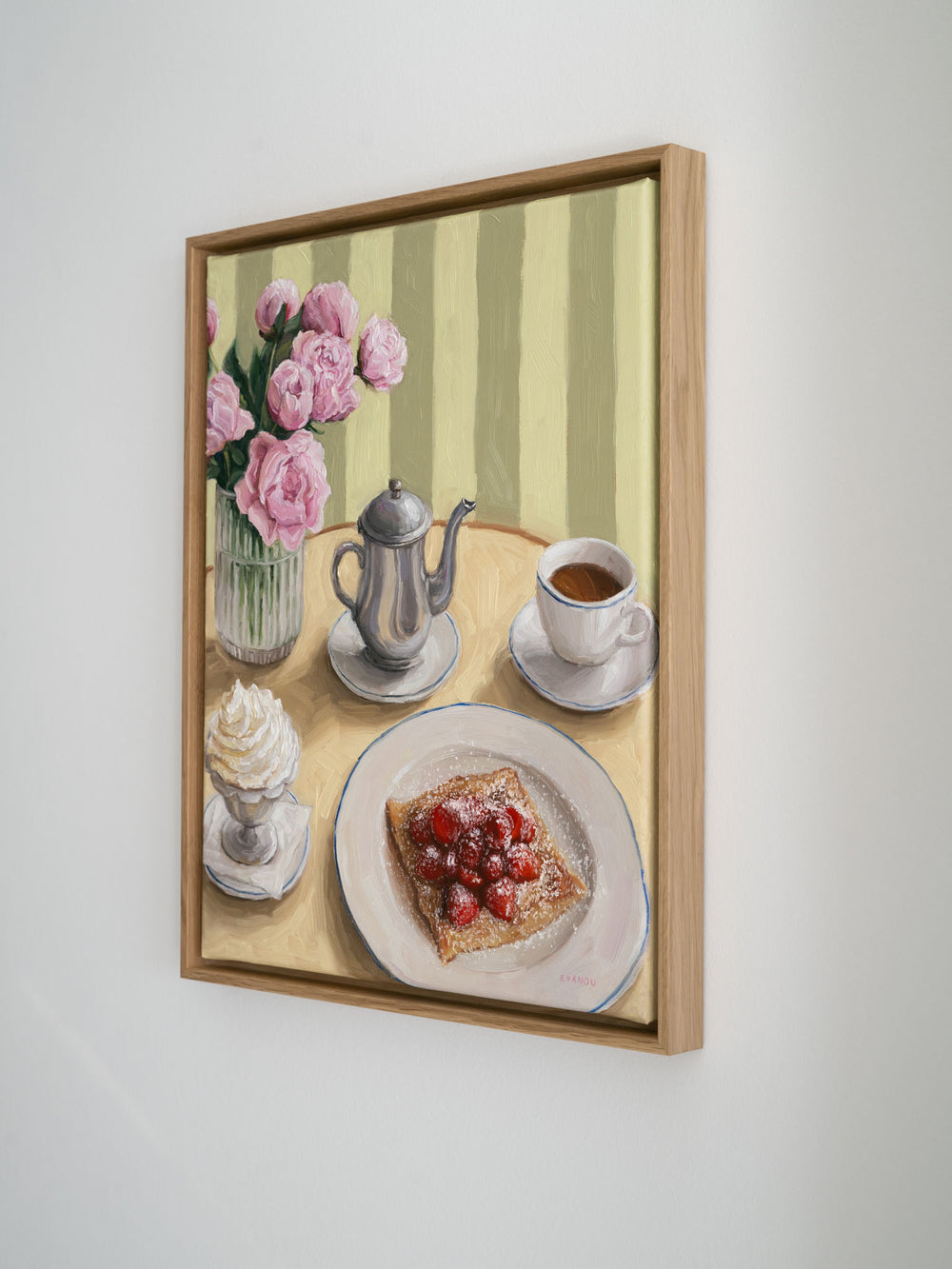 Framed artwork of a still life scene with flowers, coffee set, whipped cream and crepe with strawberries on a table.