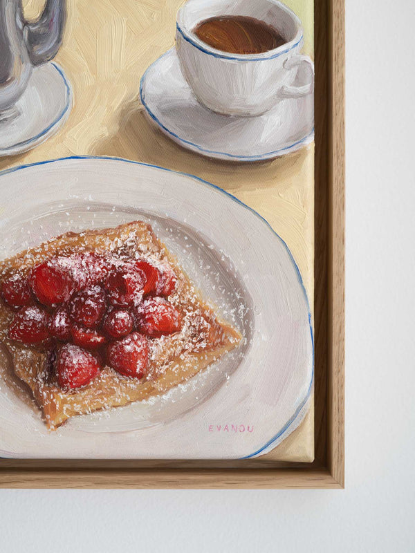 Framed artwork of a dessert with berries and a cup of coffee on a plate.